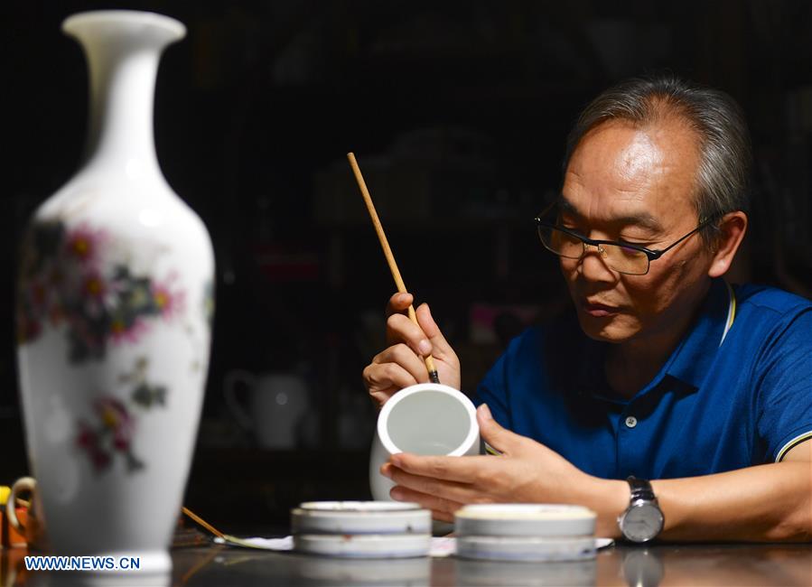 Inheritor of Jingdezhen porcelain painting in China's Jiangxi.